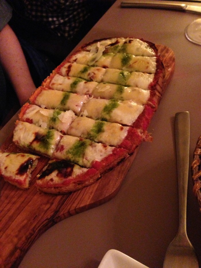 after shopping at a few stores, we ducked into a wine bar for food ... and while we thought we were ordering some kind of bruschetta - it ended up essentially being pizza!